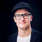 Headshot of Dominik Gasser, Founder & Creative Director at Reach Partners AG | DevOut Labs' Partner
